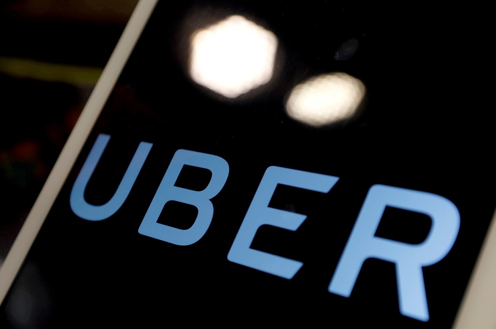 file photo: the logo of uber is seen on an ipad, during a news conference to announce uber resumes ride hailing service, in taipei