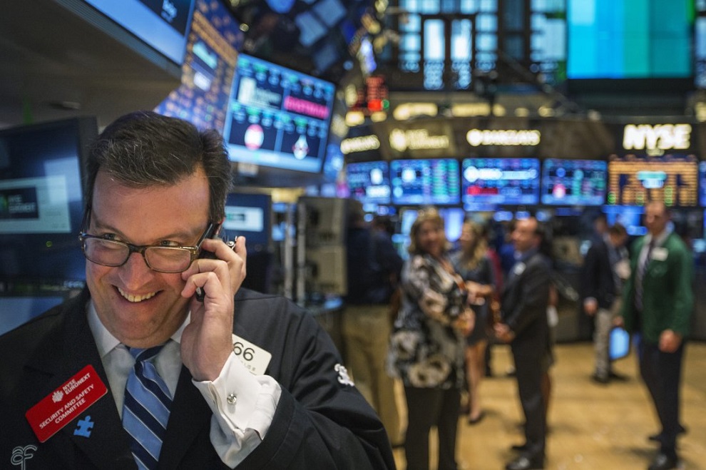 a trader works on the floor of the new york stock exchange shortly before the end of the day's trading in new york